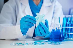 Female biotechnologist testing new chemical substances in a laboratory. photo