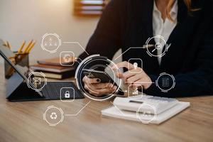 Business hand analyzing sales data and economic growth and pointing at business report document with icon and graph financial, marketing, online banking and payment, at office photo
