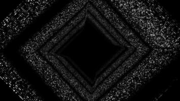 Unfocused circles in the shape of a cube in motion on a black background video