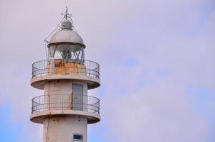 Lighthouse by the sea photo