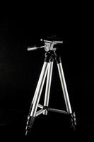 Tripod on black photo