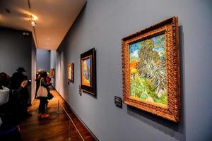 Unidentified people and artwork in the Musee d Orsay in Paris, France, circa October 2022 photo