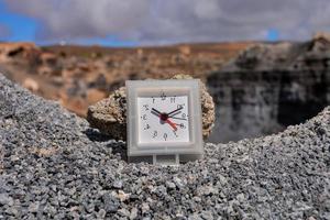 Clock on gravel photo