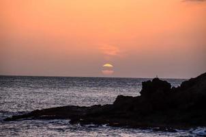 Sunset by the beach photo