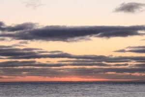 Sunset over the ocean photo