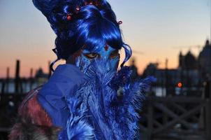 Unidentified people wearing carnival masks at the Venice Carnival in Venice, Italy, circa February 2022 photo