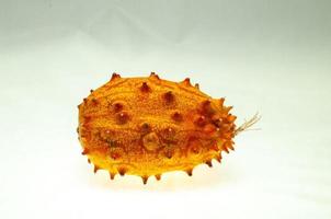 Kiwano melon close-up on white background photo