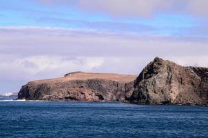 Rocky shoreline in summer photo