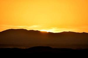 Sunrise over mountains photo