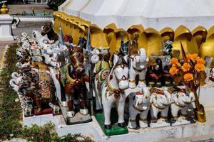 Buddhist sculptures in a temple in Bangkok, Thailand, circa May 2022 photo