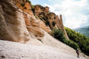 Hiker near mountains photo