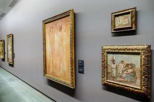 Unidentified people and artwork in the Musee d Orsay in Paris, France, circa October 2022 photo