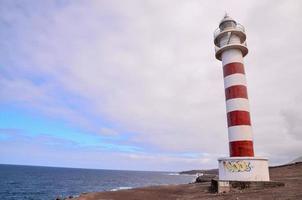 Lighthouse by the sea photo