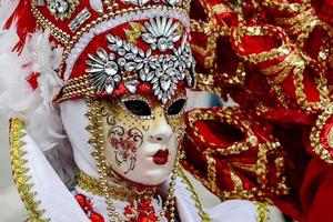 Unidentified people wearing carnival masks at the Venice Carnival in Venice, Italy, circa February 2022 photo