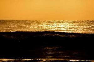 Sunset over the ocean photo