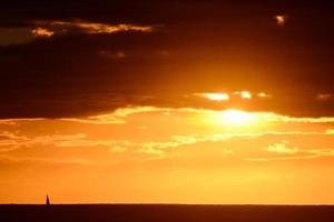 Sunset over the ocean photo