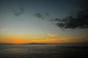 Sunset over the ocean photo