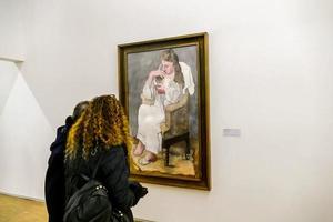 Unidentified people and artwork in the Musee d Orsay in Paris, France, circa October 2022 photo