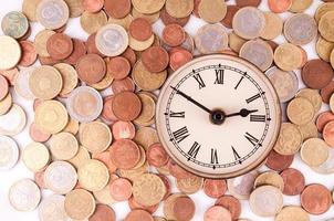 Clock and coins photo