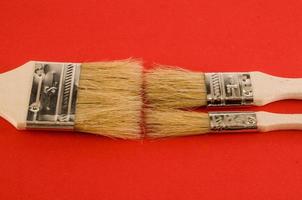 Paintbrushes on red photo