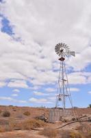 Windmill in desert photo