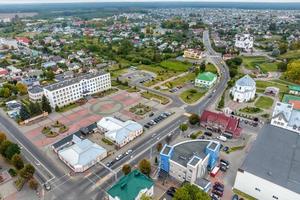 aerial panoramic view from great height of provincial town with a private sector and high-rise urban apartment buildings photo