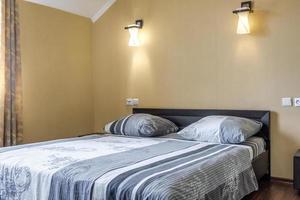 interior of cheapest bedroom in studio apartments or hostel photo
