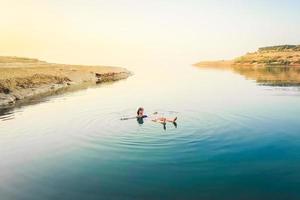 Tourist by dead sea photo