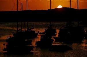 Boats at sunset photo