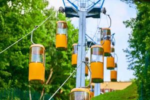 Aerial lift for tourists, transport from mountain to sea beach photo