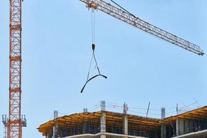 Construction crane working on building complex photo