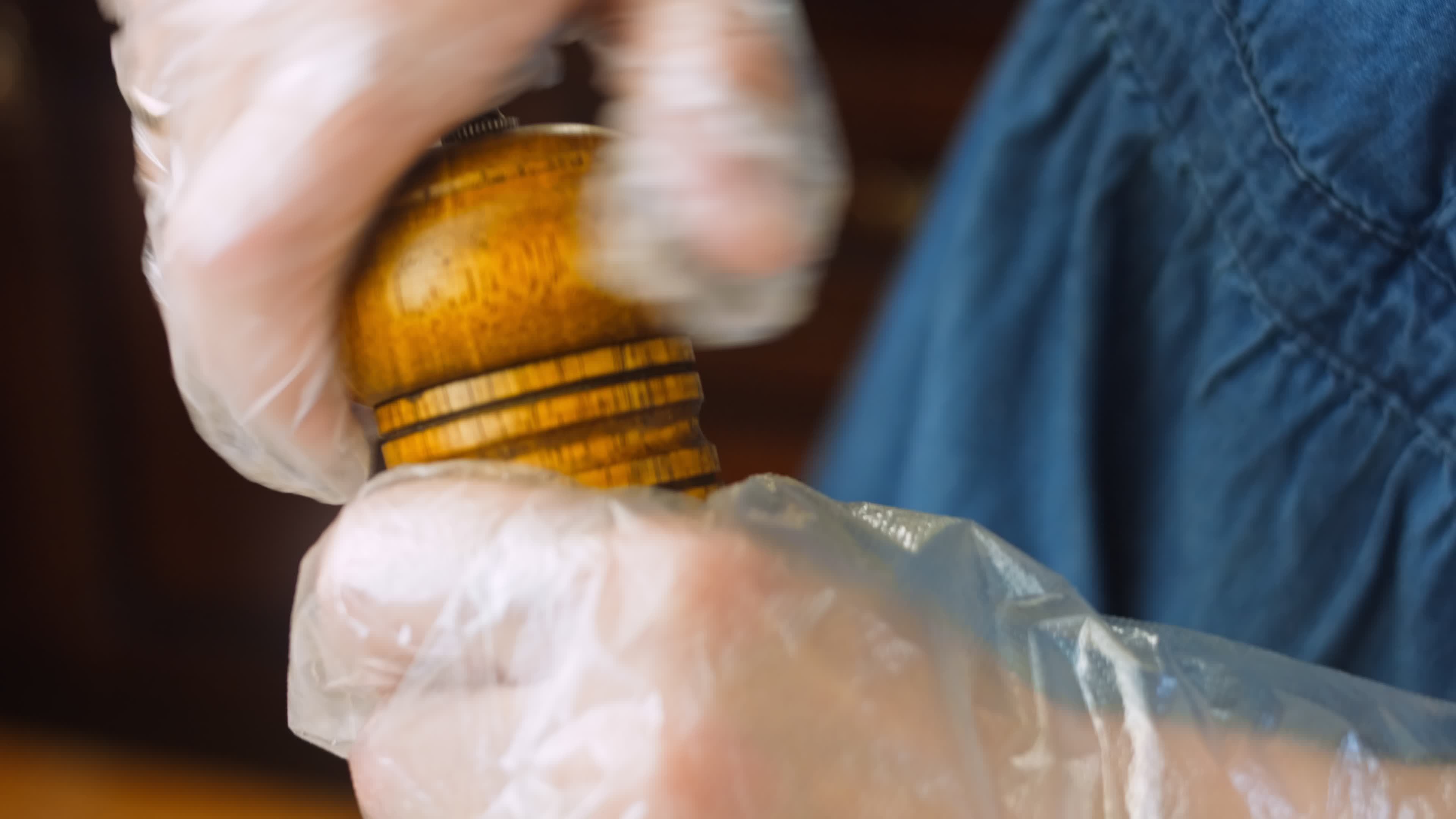 Macro filming of Worcestershire sauce. The chef pours the sauce into a