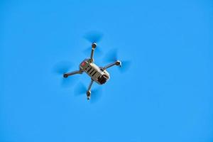 Quadcopter drone in sky photo