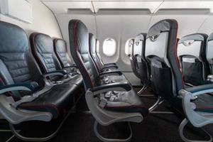 Airplane seats and windows. Economy class comfortable seats without passengers. New low-cost carrier airline