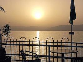 A sunrise over the sea of Galilee photo