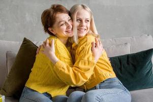 Happy mother and daughter hugging. Bonding, improving family relations photo