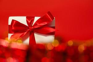 A big gift box behind bokeh. Holidays concept photo