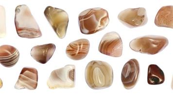 Persian agate stones set texture on white light isolated background. Moving right seamless loop backdrop. video