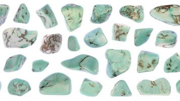 Turquoise jewel stones set texture on white light isolated background. Moving right seamless loop backdrop. video