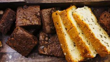 Different kinds of cakes arranged on a wooden tray video