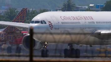 PHUKET, THAILAND NOVEMBER 13, 2019 - Cathay Dragon Airbus A330 taxiing before departure from Phuket airport. video