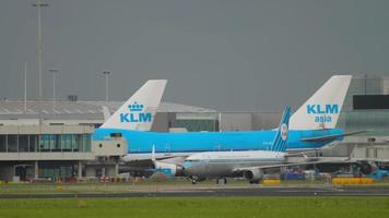 AMSTERDAM, THE NETHERLANDS JULY 27, 2017 - Boeing 737 of KLM taxiing to the terminal after landing at Schiphol Airport, Amsterdam. Tourism and travel concept video