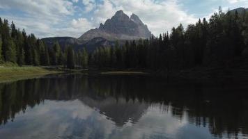 Antorno Lake and Tre Cime di Lavaredo Peaks Reflection in Italian Dolomites aerial view, Italy video