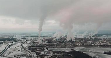 aerial view on smoked pipes of chemical enterprise plant. Air pollution concept. Industrial winter landscape environmental pollution waste of thermal power plant video
