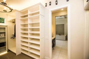 Master Bedroom Closet With Built In Shelving photo