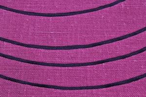 Abstract design background of violet coarse-grained intersection texture of rough fabric with an interlacing black painted lines. Linen sack textile canvas burlap cloth. Close-up, mock up, top view photo