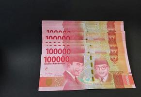 Rupiah banknotes arranged in a neat pattern photo