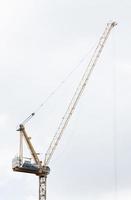 Tower construction crane with white background photo