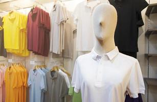 Mannequin with white shirt in clothing store photo