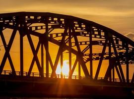 Support above the bridge, steel structure, and sunshine light photo